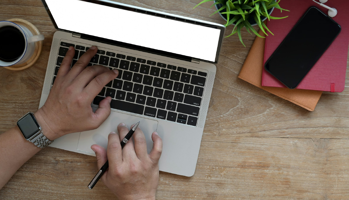 A person on their laptop researching potential reasons why their insurance company is investigating them.